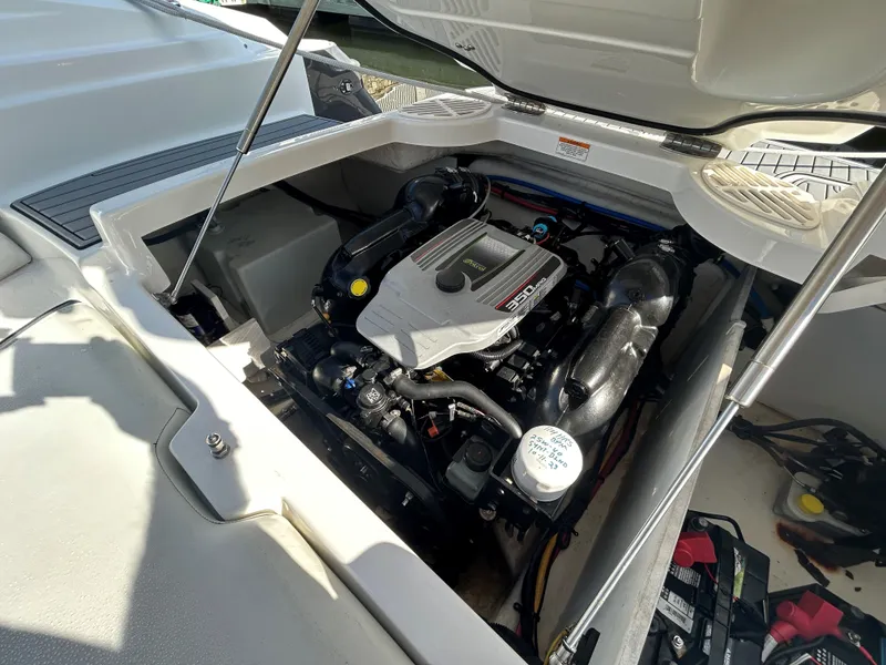 Slide: The Image of 2015 Monterey 244 FSX boat engine compartment with open hatch. - 14