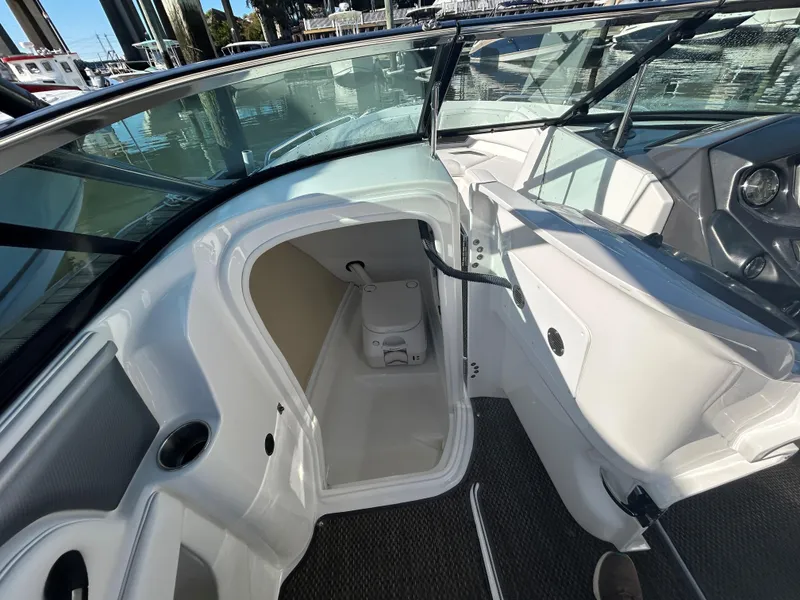 Slide: The Image of 2015 Monterey 244 FSX boat interior with compact cabin and toilet. - 8