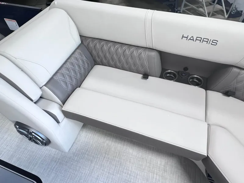 Slide: The Image of 2024 Harris Sunliner 230 boat interior with luxurious seating and elegant design. - 19