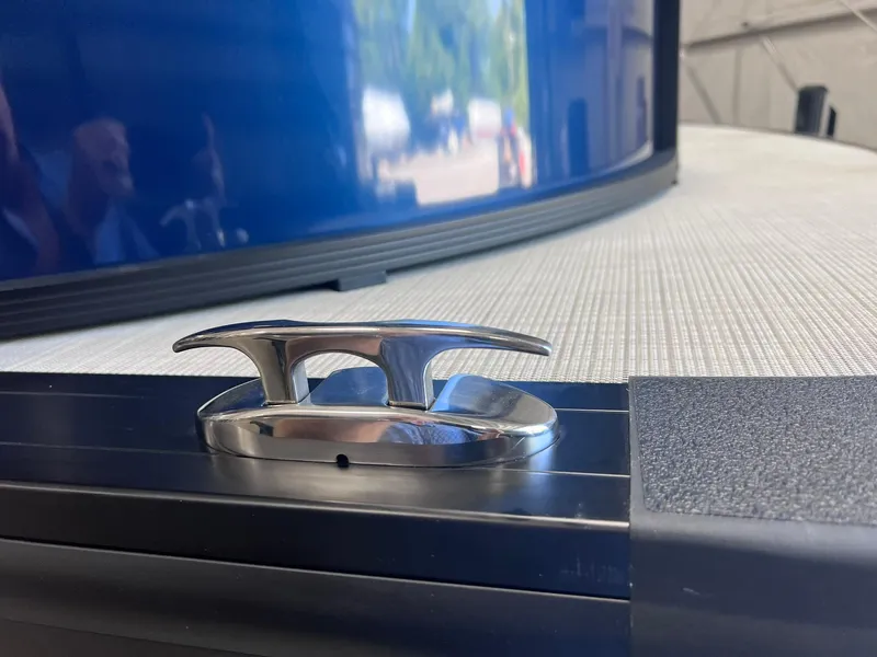 Slide: The Image of 2024 Harris Sunliner 230 boat cleat on deck, close-up view. - 23