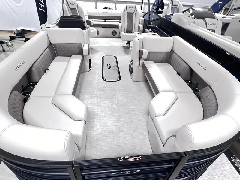 Slide: The Image of 2024 Harris Sunliner 230 pontoon boat with luxurious seating and modern design. - 5