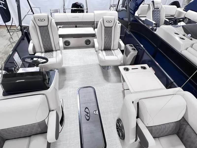 Slide: The Image of 2024 Harris Sunliner 230 boat interior with luxurious seating and modern design. - 6