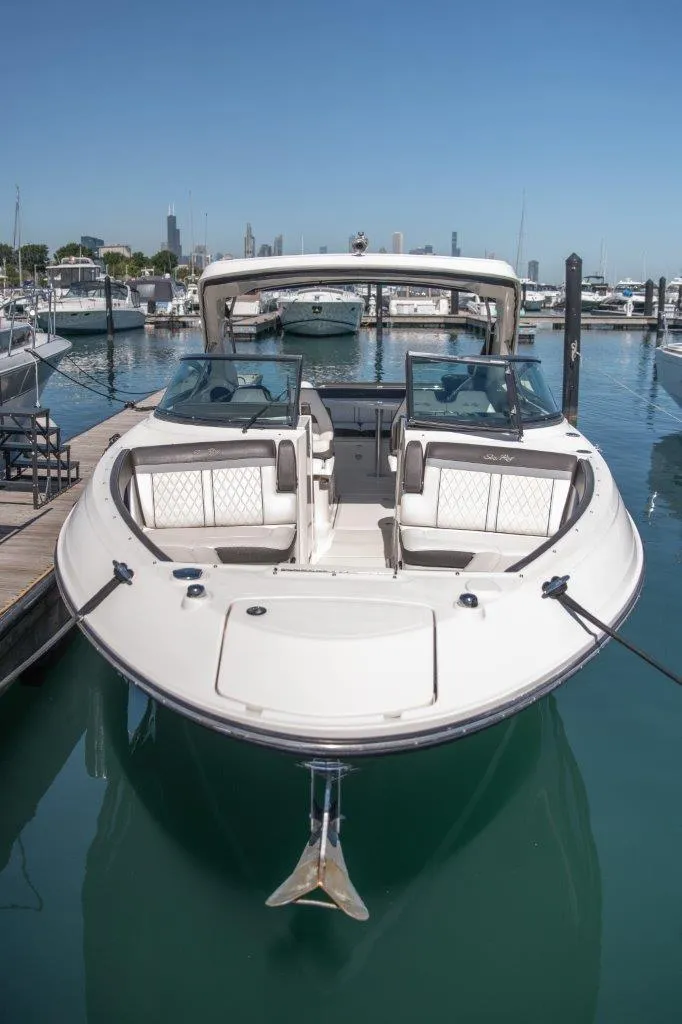 Slide: The Image of 2017 Sea Ray 350 SLX luxury boat docked in marina. - 2