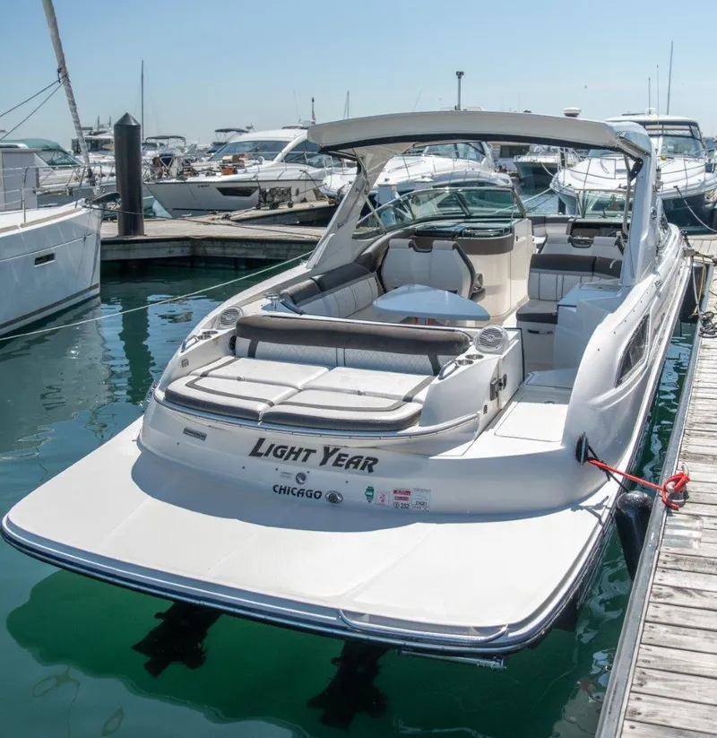Slide: The Image of 2017 Sea Ray 350 SLX luxury boat docked in marina. - 3