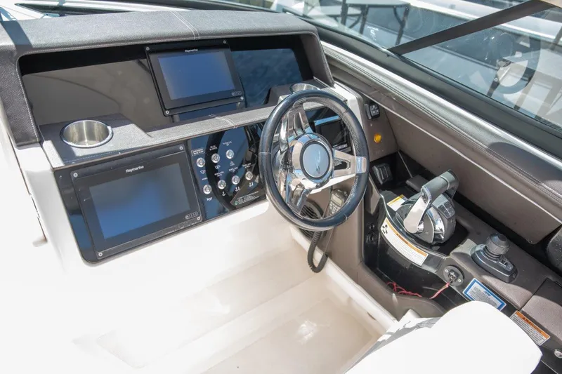 Slide: The Image of 2017 Sea Ray 350 SLX helm with modern controls and navigation displays. - 6
