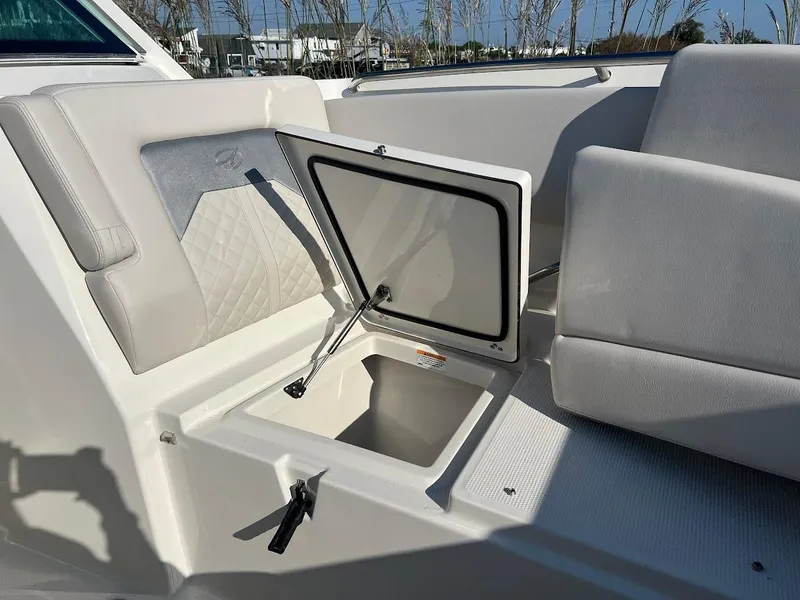 Slide: The Image of 2025 Sailfish 316 DC boat interior with open storage compartment. - 29