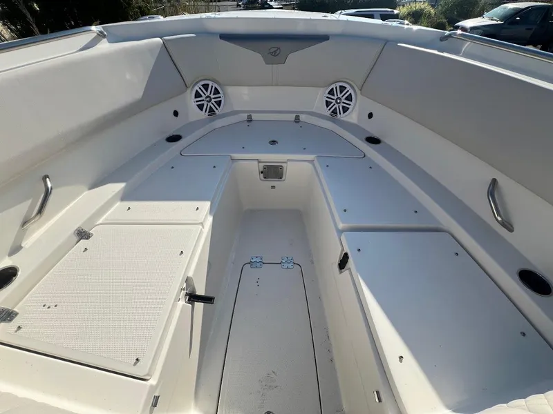 Slide: The Image of 2025 Sailfish 316 DC boat interior with storage compartments and speakers. - 30