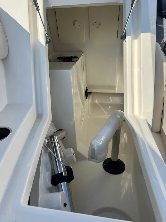 Slide: The Image of Interior view of 2025 Sailfish 316 DC boat, showcasing storage compartment and fixtures. - 31