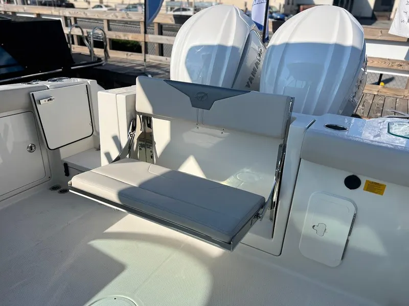Slide: The Image of 2025 Sailfish 316 DC boat interior with foldable seat and dual engines. - 6
