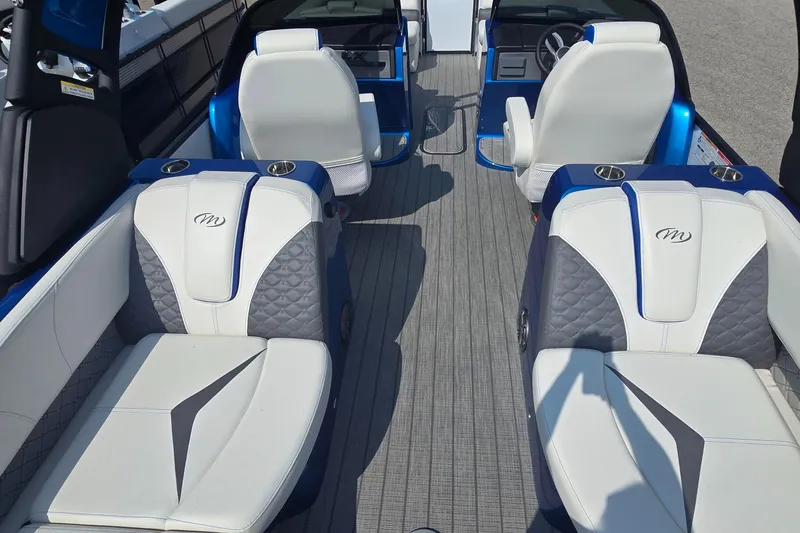 Slide: The Image of Luxurious interior of 2025 Manitou 25' LX RFXW pontoon boat with stylish seating. - 8