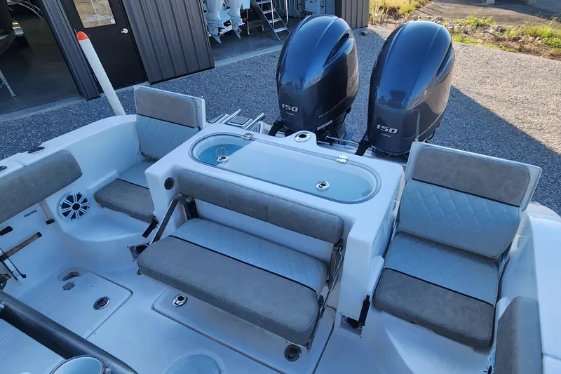 Slide: The Image of 2019 Sea Fox 266 Commander boat interior with dual engines and seating. - 5