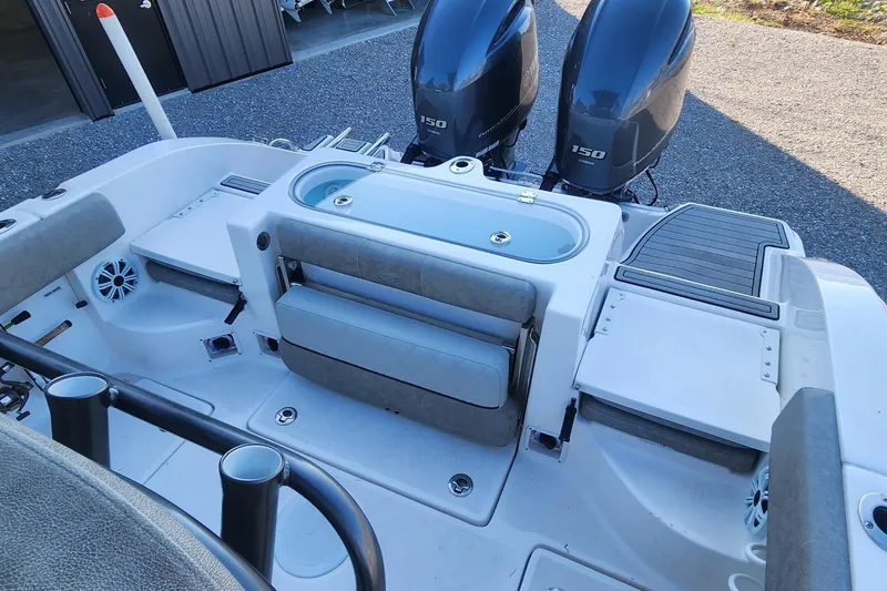 Slide: The Image of 2019 Sea Fox 266 Commander boat with dual 150 engines, spacious deck, and seating area. - 6