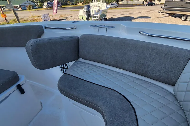 Slide: The Image of 2019 Sea Fox 266 Commander boat interior with cushioned seating and stainless steel handrails. - 8