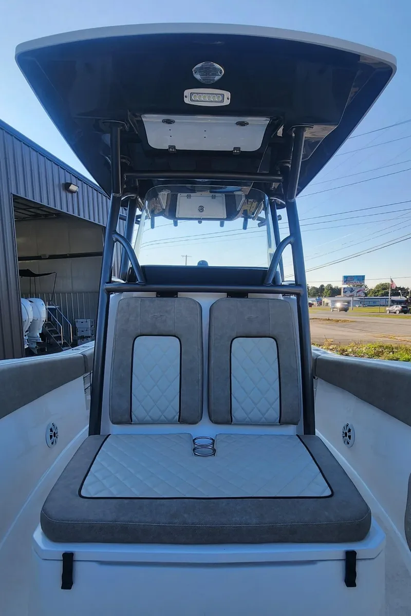 Slide: The Image of 2019 Sea Fox 266 Commander boat interior with cushioned seating and T-top. - 9
