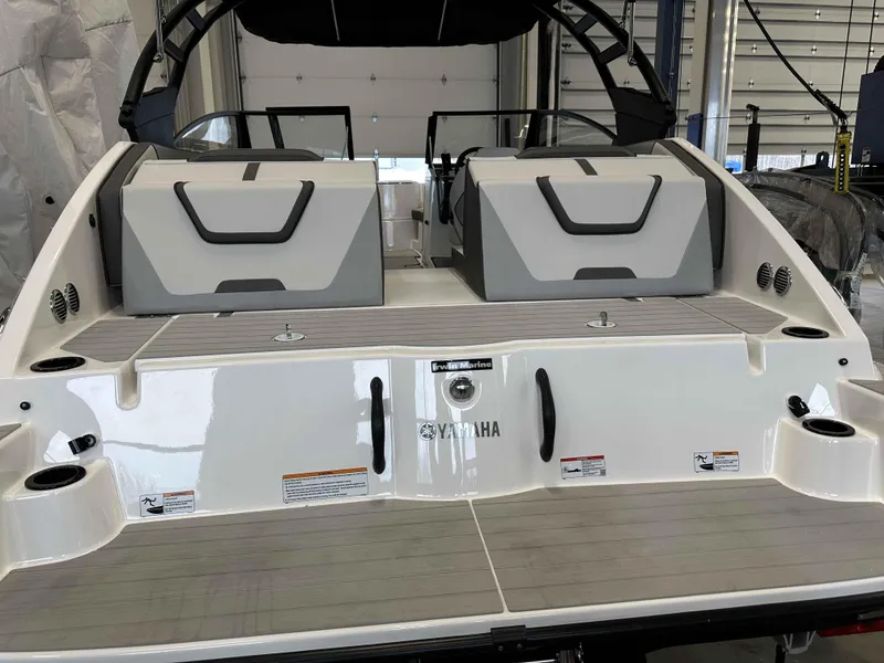 Slide: The Image of 2025 Yamaha Boats AR220, rear view in a showroom, showcasing sleek design and modern features. - 3