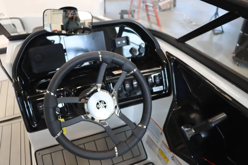 Slide: The Image of 2025 Yamaha Boats 195S steering wheel and dashboard interior view. - 14