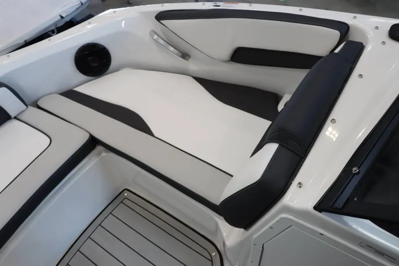 Slide: The Image of 2025 Yamaha Boats 195S interior seating with sleek black and white design. - 19