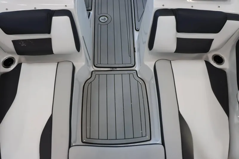 Slide: The Image of Interior seating of 2025 Yamaha Boats 195S, featuring sleek black and white design. - 21