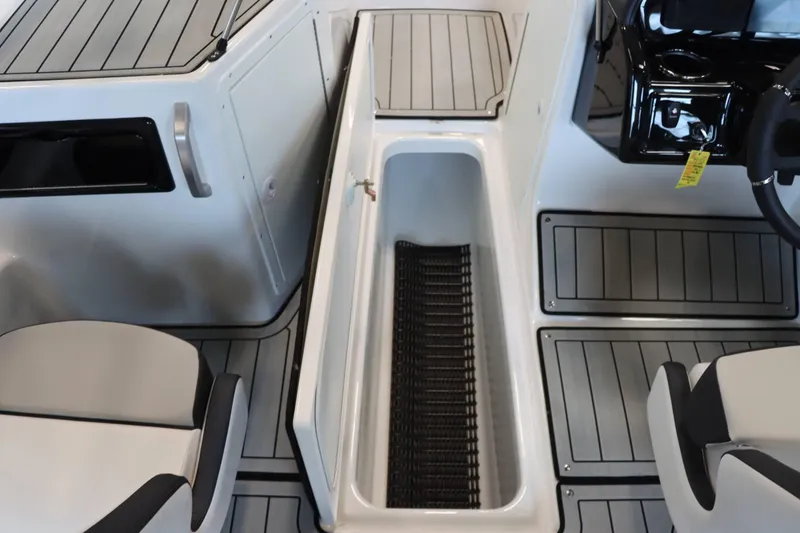Slide: The Image of Interior view of 2025 Yamaha Boats 195S, featuring seating and storage area. - 25