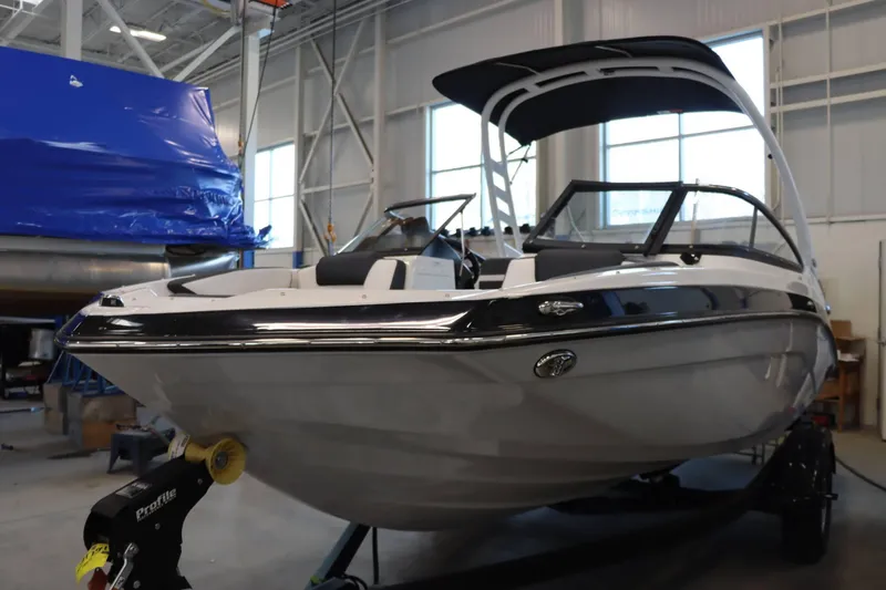 Slide: The Image of 2025 Yamaha Boats 195S in a showroom, showcasing sleek design and modern features. - 3