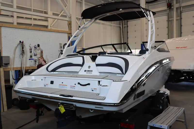 Slide: The Image of 2025 Yamaha Boats 195S in a showroom, showcasing sleek design and modern features. - 4