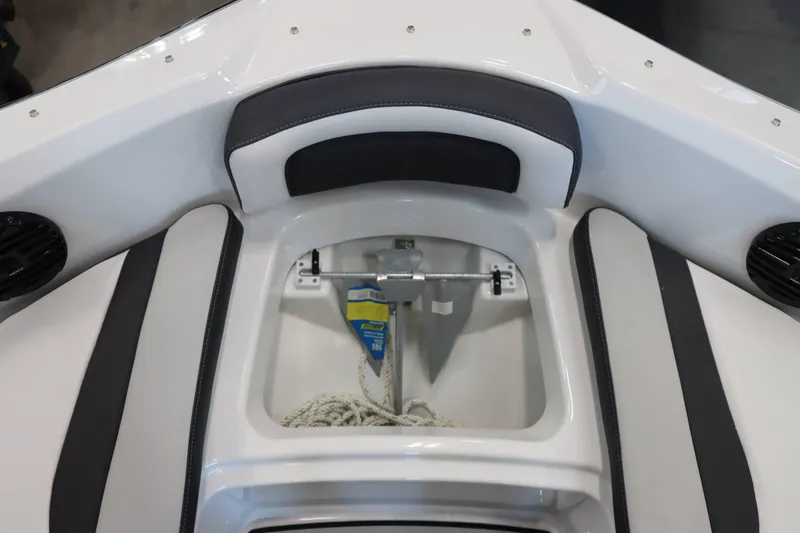 Slide: The Image of 2025 Yamaha Boats 195S anchor storage compartment with seating and speakers. - 20