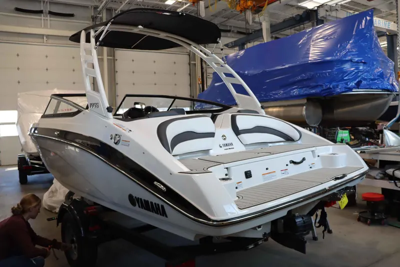 Slide: The Image of 2025 Yamaha Boats 195S in a garage, showcasing sleek design and modern features. - 3