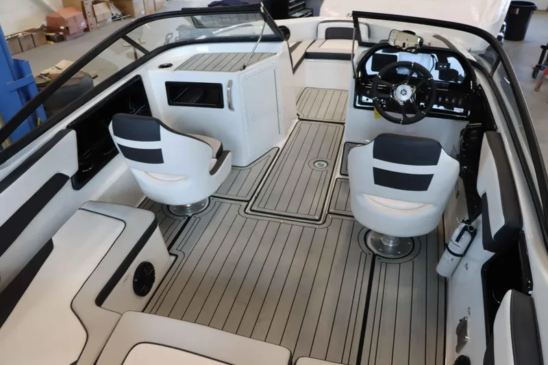 Slide: The Image of 2025 Yamaha Boats 195S interior with sleek seating and modern dashboard design. - 8