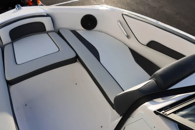 Slide: The Image of 2025 Yamaha Boats 195S interior seating with sleek, modern design and comfortable upholstery. - 10