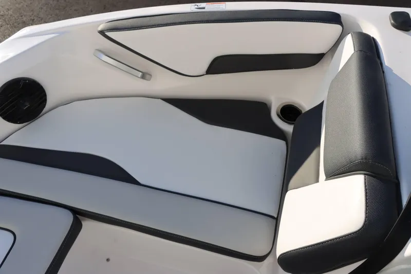 Slide: The Image of 2025 Yamaha Boats 195S interior seating with sleek black and white design. - 11