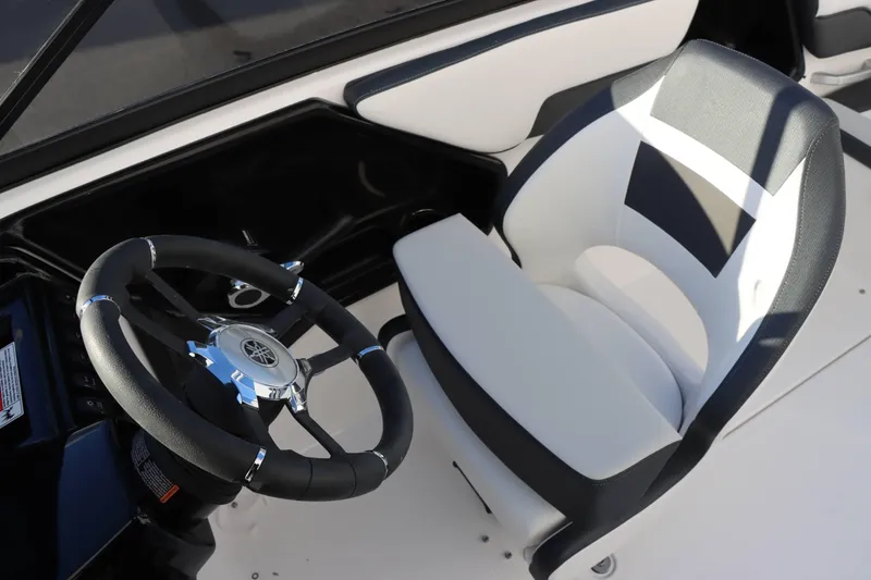Slide: The Image of 2025 Yamaha Boats 195S cockpit with steering wheel and comfortable seating. - 15