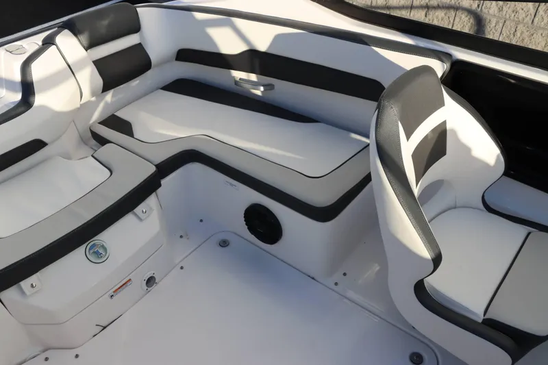 Slide: The Image of 2025 Yamaha Boats 195S interior seating with sleek black and white design. - 17