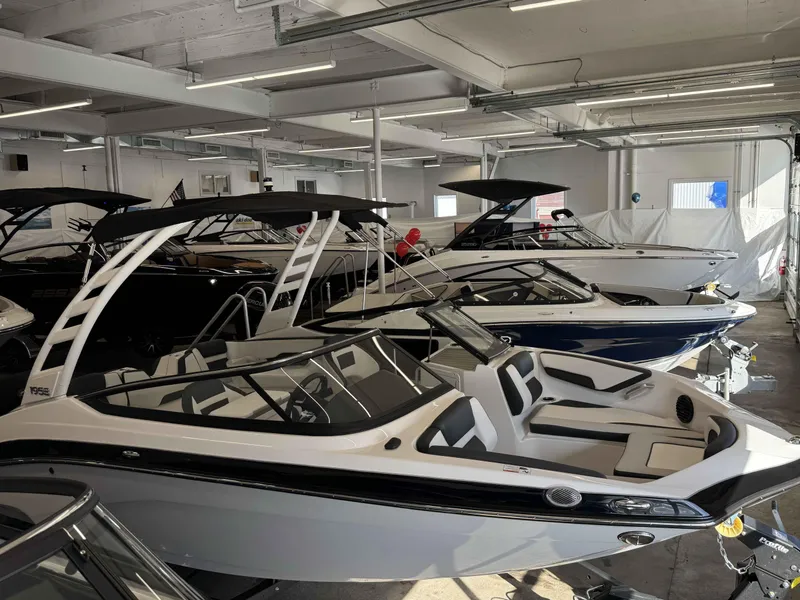 Slide: The Image of 2025 Yamaha Boats 195S models displayed in a showroom, featuring sleek design and modern features. - 22