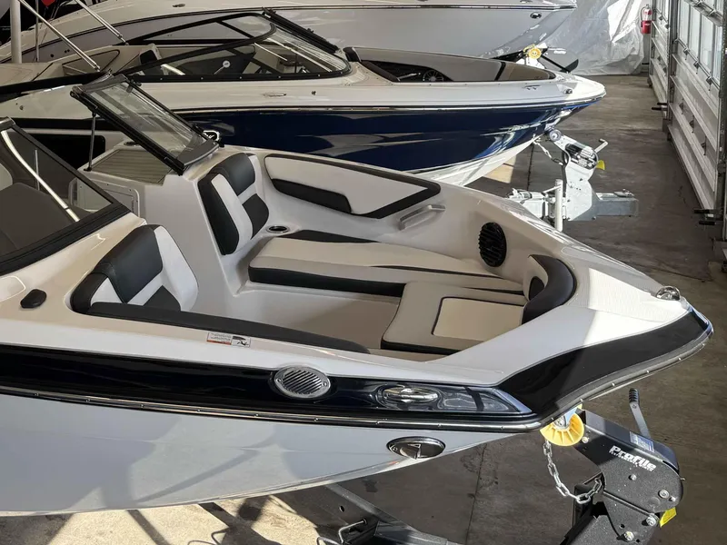 Slide: The Image of 2025 Yamaha Boats 195S, sleek design, modern interior, displayed in showroom. - 24