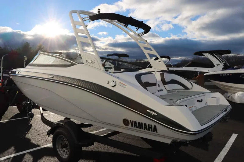 Slide: The Image of 2025 Yamaha Boats 195S in sunlight, parked on a trailer. - 5
