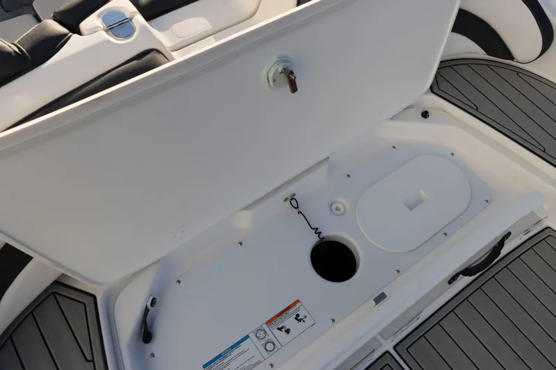 Slide: The Image of Open storage compartment on 2025 Yamaha Boats 195S, featuring sleek design and practical layout. - 7
