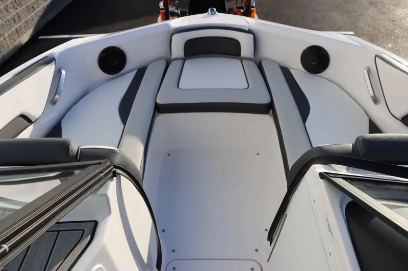 Slide: The Image of 2025 Yamaha Boats 195S interior seating, featuring sleek white and gray upholstery. - 8