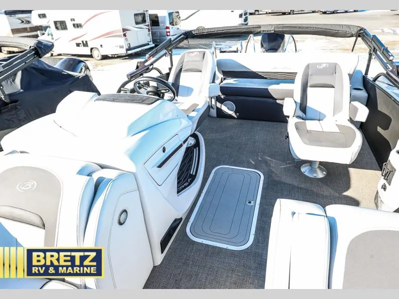 Slide: The Image of Interior of 2023 CORSA 23UC boat with modern seating and steering wheel, Bretz RV & Marine. - 14