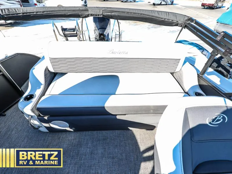 Slide: The Image of 2023 CORSA 23UC boat interior with cushioned seating, showcased by Bretz RV & Marine. - 22