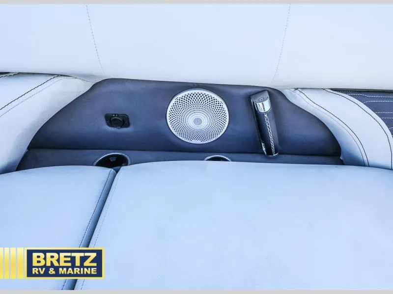 Slide: The Image of 2023 CORSA 23UC boat interior with speaker, cup holders, and Bretz RV & Marine logo. - 30