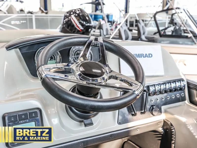 Slide: The Image of 2024 Aria Ultra-Lounge A24UC boat steering wheel and dashboard at Bretz RV & Marine. - 12
