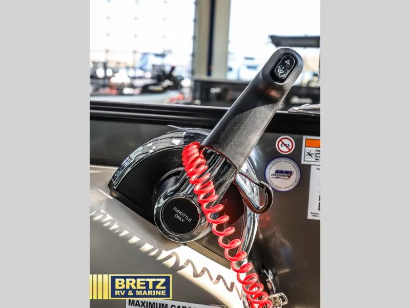 Slide: The Image of Close-up of 2024 Aria Ultra-Lounge A24UC throttle control with red coiled cord. - 14