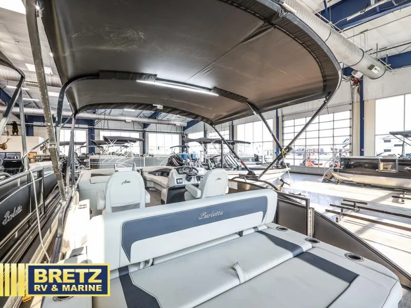 Slide: The Image of 2024 Aria Ultra-Lounge A24UC boat interior at Bretz RV & Marine showroom. - 16