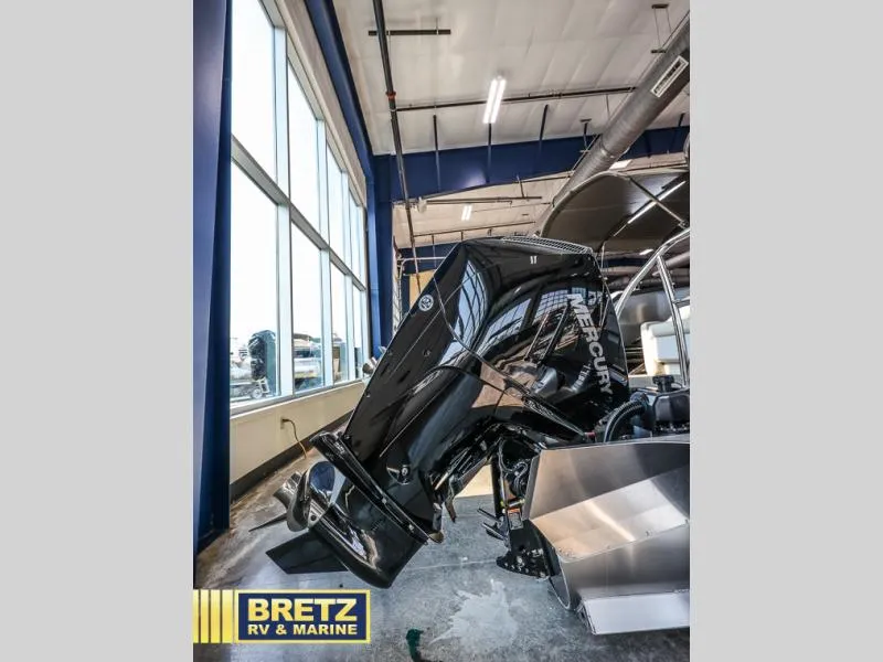 Slide: The Image of 2024 Aria Ultra-Lounge A24UC boat with Mercury engine in showroom. - 6