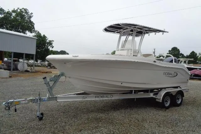 The Image of 2025 Robalo R202 Explorer boat on trailer, parked outdoors. - 19