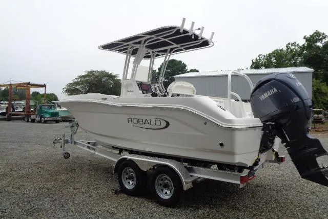 Slide: The Image of 2025 Robalo R202 Explorer boat on trailer with Yamaha outboard motor. - 21