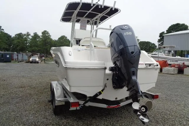 Slide: The Image of 2025 Robalo R202 Explorer boat with outboard motor on trailer. - 22