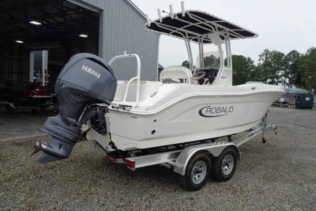Slide: The Image of 2025 Robalo R202 Explorer boat with Yamaha engine on a trailer. - 23