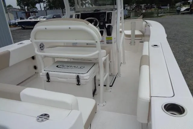 Slide: The Image of 2025 Robalo R202 Explorer boat interior with seating and console, showcasing modern design. - 28