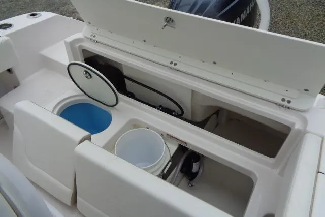 Slide: The Image of 2025 Robalo R202 Explorer boat storage compartments and livewell, showcasing practical design features. - 37
